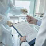 Medical doctors reviewing a medical chart before medical malpractice.
