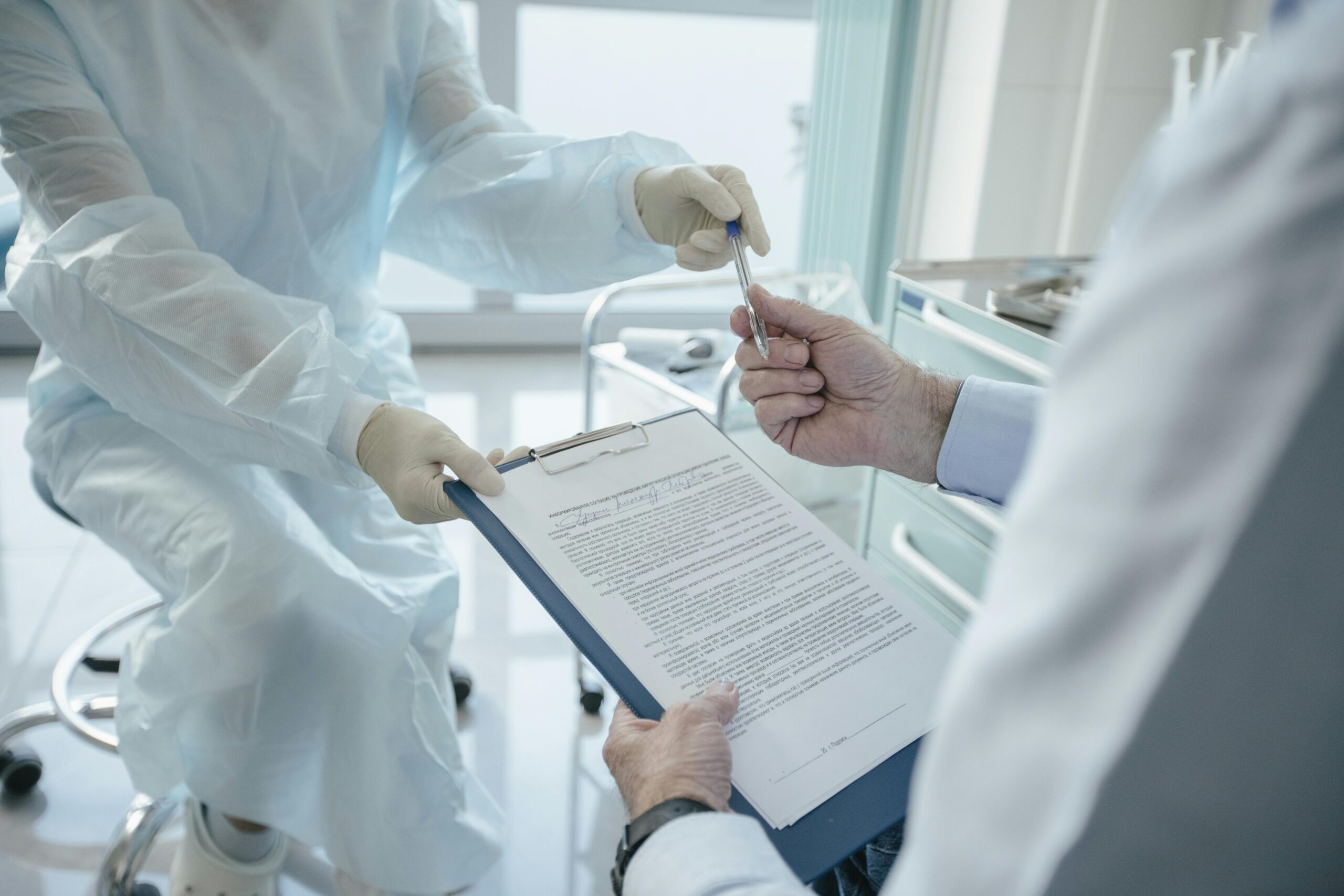 Medical doctors reviewing a medical chart before medical malpractice.